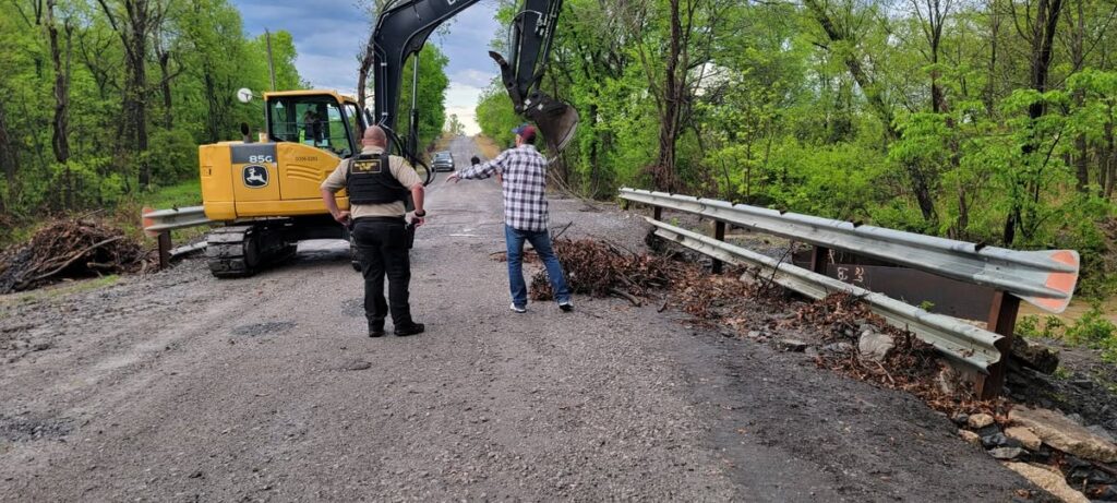 Commissioner James Hanning working with debris removal crews in Wagoner County District 1