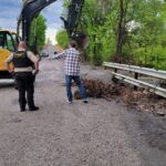 Commissioner James Hanning working with debris removal crews in Wagoner County District 1
